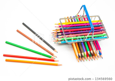 Colorful assortment of drawing pencils displayed in a metal basket on a white background Colorful assortment of drawing pencils displayed in a metal basket on a white background 134569560