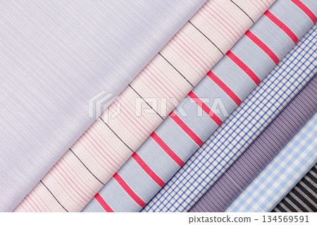 Variety of colorful fabrics displayed in a textile store for fashion design enthusiasts 134569591