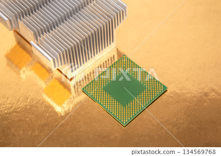 Advanced computer chip and heatsink displayed on a reflective surface in a tech setup 134569768