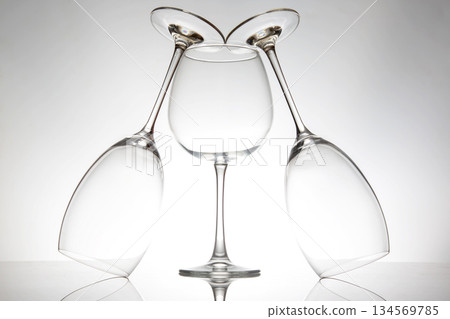 Creative arrangement of glassware highlighting reflections and shapes 134569785