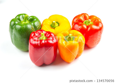 Colorful assortment of bell peppers on white background showcasing vibrant shades Colorful assortment of bell peppers on white background showcasing vibrant shades 134570056
