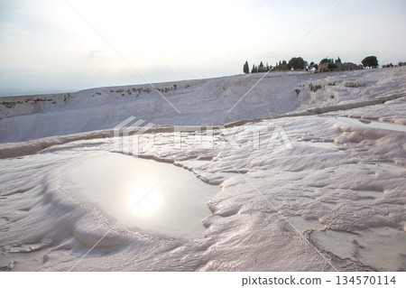 Stunning travertine terraces of Pamukkale reflect sunlight in Turkey's natural wonders Stunning travertine terraces of Pamukkale reflect sunlight in Turkey's natural wonders 134570114