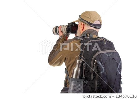 Photographer capturing stunning images with a camera in outdoor setting 134570136