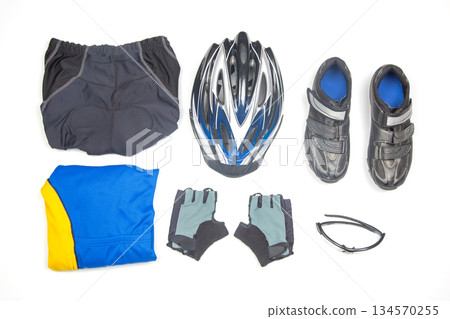 Cycling gear laid out on a clean surface for a biking adventure in bright daylight Cycling gear laid out on a clean surface for a biking adventure in bright daylight 134570255