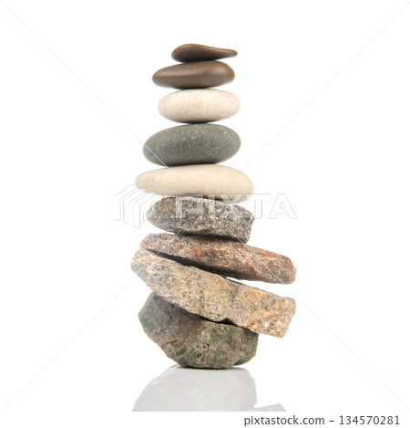 Stacked stones arranged in a balanced formation showcasing natural beauty and tranquility Stacked stones arranged in a balanced formation showcasing natural beauty and tranquility 134570281