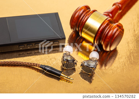 Legal tools and technology combined on a reflective surface with audio equipment Legal tools and technology combined on a reflective surface with audio equipment 134570282