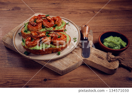 sandwiches with avocado and caramelized shrimp, micro-greens, breakfast, on a plate, top view, homemade, no people, sandwiches with avocado and caramelized shrimp, micro-greens, breakfast, on a plate, top view, homemade, no people, 134571030