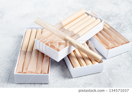 cigarette casings, packed in boxes, on the table, top view, 134571037