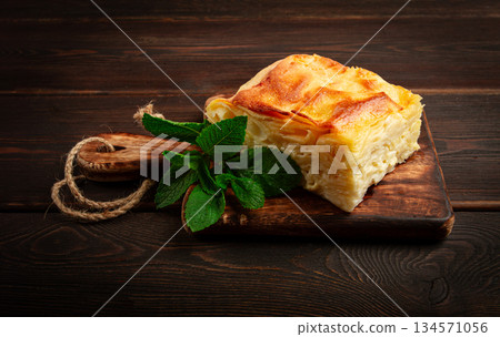 Achma, khachapuri, Georgian cuisine, homemade, no people, on a wooden background, 134571056
