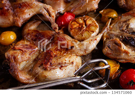 grilled quail meat, on a platter, tobacco, in the oven, with spices, homemade, without people, 134571060