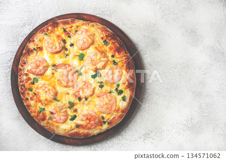 four cheese pizza with shrimp and fresh microgreens, served on a wooden board, homemade, no people, 134571062