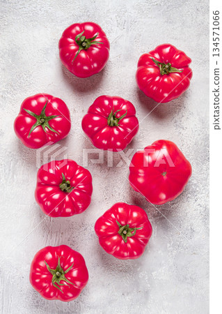 pink tomatoes scattered on the table, top view, close-up, no people, 134571066