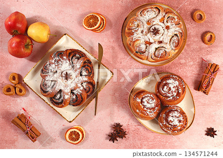 Apple pies, buns, cupcakes with apples, cinnamon, poppy seeds, cranberries, and egg liqueur.homemade delicious dessert,Festive kitchen banner. The concept of festive pastries, seasonal treats Apple pies, buns, cupcakes with apples, cinnamon, poppy seeds, cranberries, and egg liqueur.homemade delicious dessert,Festive kitchen banner. The concept of festive pastries, seasonal treats 134571244