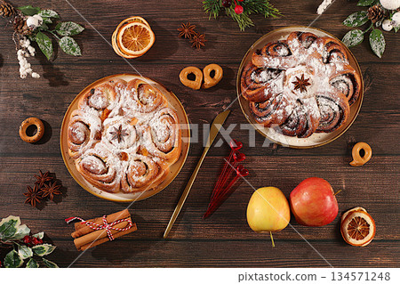 Apple pies and cupcakes with nuts, cinnamon, poppy seeds, cranberries, and egg liqueur.Homemade winter dessert,Festive kitchen banner. The concept of festive pastries, Apple pies and cupcakes with nuts, cinnamon, poppy seeds, cranberries, and egg liqueur.Homemade winter dessert,Festive kitchen banner. The concept of festive pastries, 134571248