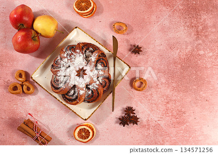 Apple pies, buns, cupcakes with apples, cinnamon, poppy seeds, cranberries, and egg liqueur.homemade delicious dessert,Festive kitchen banner. The concept of festive pastries, seasonal treats Apple pies, buns, cupcakes with apples, cinnamon, poppy seeds, cranberries, and egg liqueur.homemade delicious dessert,Festive kitchen banner. The concept of festive pastries, seasonal treats 134571256