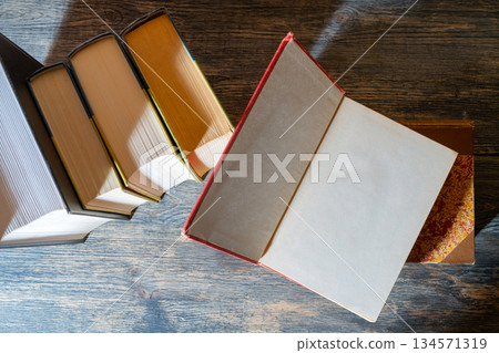 Thick paper books are a symbol of education and wisdom. A stack of books on the table. Thick paper books are a symbol of education and wisdom. A stack of books on the table. 134571319