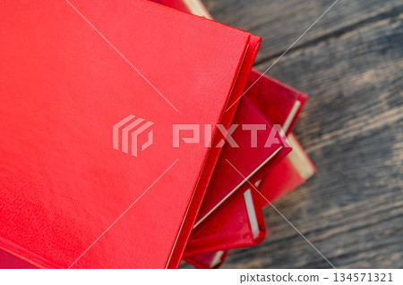 Pile of new books. Books in red covers. Training and education on the pages of books. Pile of new books. Books in red covers. Training and education on the pages of books. 134571321