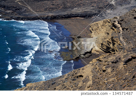 Rocky Tenerife coast around Montana Bocinegro and Montana Roja mountain, near El Medano, Canary Islands, Spain, sunny summer day Rocky Tenerife coast around Montana Bocinegro and Montana Roja mountain, near El Medano, Canary Islands, Spain, sunny summer day 134571487