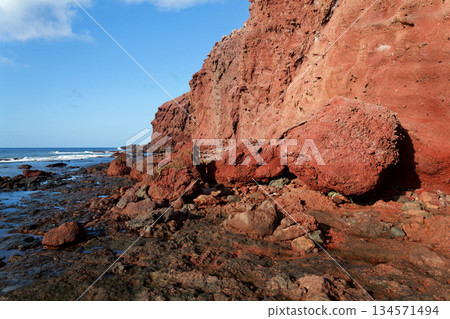 Rocky Tenerife coast around Montana Bocinegro and Montana Roja mountain, near El Medano, Canary Islands, Spain, sunny summer day Rocky Tenerife coast around Montana Bocinegro and Montana Roja mountain, near El Medano, Canary Islands, Spain, sunny summer day 134571494