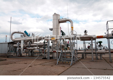 Pipes and caps for pipelines leading from oil and gas fields to storage tanks, energy self-sufficiency concept, global market forecast concept 134573542