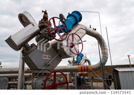 Pipes and caps for pipelines leading from oil and gas fields to storage tanks, energy self-sufficiency concept, global market forecast concept Pipes and caps for pipelines leading from oil and gas fields to storage tanks, energy self-sufficiency concept, global market forecast concept 134573543