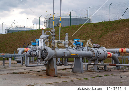 Pipes and caps for pipelines leading from oil and gas fields to storage tanks, energy self-sufficiency concept, global market forecast concept 134573544