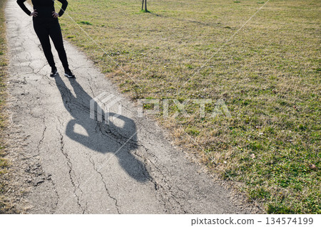 Body of woman projecting her shadow on path expressing Loneliness and Challenges Body of woman projecting her shadow on path expressing Loneliness and Challenges 134574199
