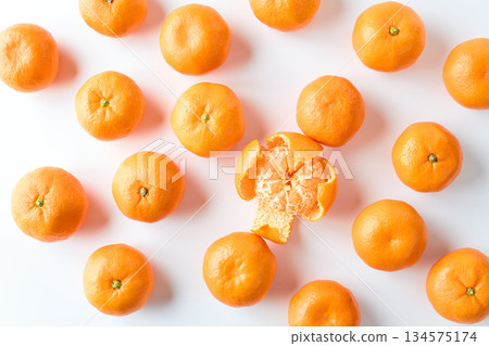 Mandarins lined up on a white background Mandarins lined up on a white background 134575174