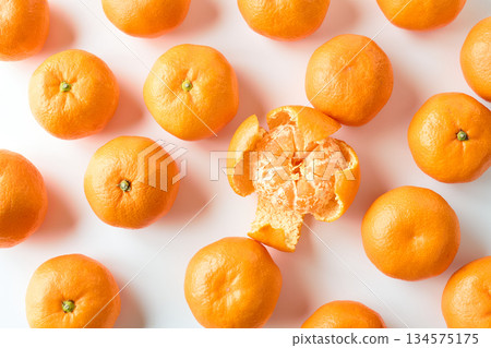 Mandarins lined up on a white background 134575175