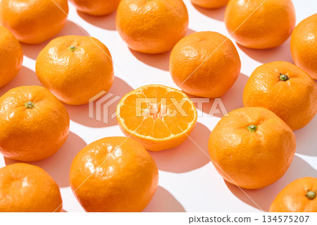 Mandarins lined up on a white background 134575207