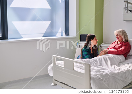 Hospital visit brings joy and comfort as family shares moments in a healing space during daytime Hospital visit brings joy and comfort as family shares moments in a healing space during daytime 134575505