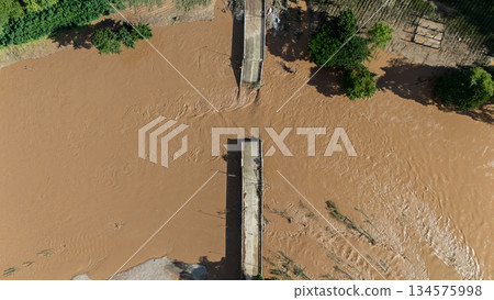 Aerial view of small bridge in Mae Yao district of Chiang Rai province collapsed after typhoon Yagi swept across Thailand. Aerial view of small bridge in Mae Yao district of Chiang Rai province collapsed after typhoon Yagi swept across Thailand. 134575998