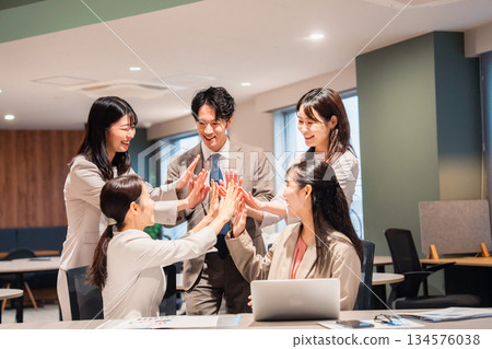 High-fiving with all office members High-fiving with all office members 134576038