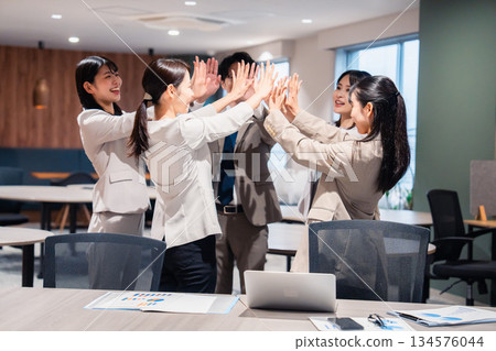 High-fiving with all office members High-fiving with all office members 134576044