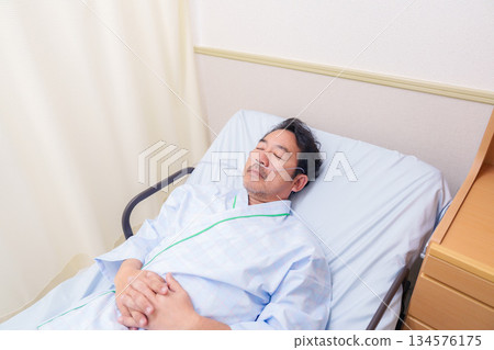 Elderly male hospitalized patient with a nasal tube 134576175