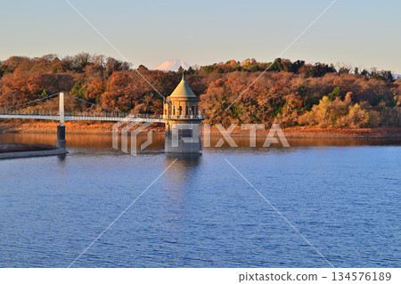 Lake Sayama, water intake tower, Mt. Fuji, morning glow view from the lakeside Lake Sayama, water intake tower, Mt. Fuji, morning glow view from the lakeside 134576189