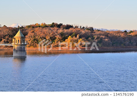 Lake Sayama, water intake tower, Mt. Fuji, morning glow view from the lakeside Lake Sayama, water intake tower, Mt. Fuji, morning glow view from the lakeside 134576190