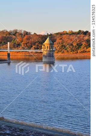 Lake Sayama, water intake tower, Mt. Fuji, morning glow view from the lakeside Lake Sayama, water intake tower, Mt. Fuji, morning glow view from the lakeside 134576325