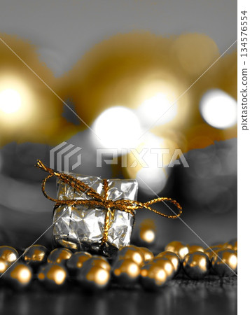 A gift placed on a shining golden stone A gift placed on a shining golden stone 134576554