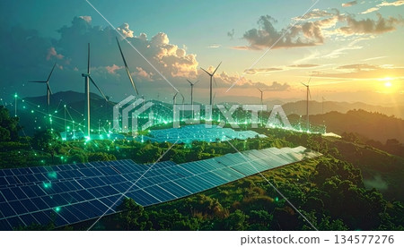 Renewable wind turbines generate clean energy across a rural landscape of green mountain meadows and summer fields under a blue sky with white clouds 134577276