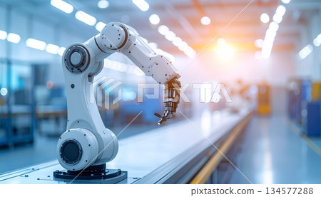 A blurry crowd of business people walking past a modern office building and through a metal subway station highlights the industrial steel equipment of city travel 134577288