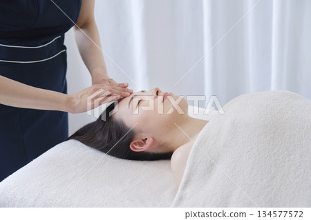 Female esthetician facial beauty treatment Female esthetician facial beauty treatment 134577572