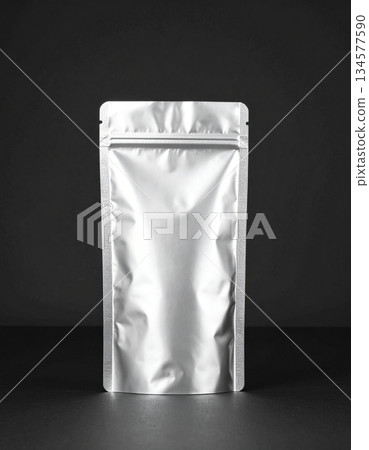 Standing Silver Foil Pouch Mockup on Black Background Standing Silver Foil Pouch Mockup on Black Background 134577590
