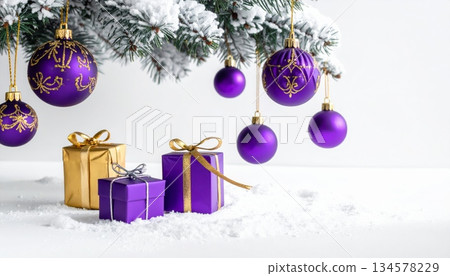Festive Christmas tree with red and gold ball ornaments and bright gift boxes on a fir branch for a winter holiday celebration Festive Christmas tree with red and gold ball ornaments and bright gift boxes on a fir branch for a winter holiday celebration 134578229