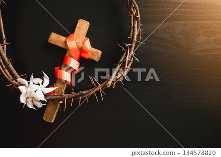 Crown of thorns, wooden cross, iron nail placed on Holy Bible, symbolizing Christian faith, sacrifice, crucifixion, Easter reflection, religion background for worship, spiritual concept Crown of thorns, wooden cross, iron nail placed on Holy Bible, symbolizing Christian faith, sacrifice, crucifixion, Easter reflection, religion background for worship, spiritual concept 134578820