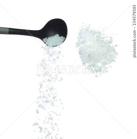 Salt rock flower pour fall in ladle, white Salt rock flower cook abstract cloud fly. Big size ground salt splash in air, food object element design. White background isolated high speed freeze motion 134579385