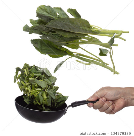 Kale fly fall in pan, green fresh vegetable chinese kale cut chop slice. Organic fresh vegetable with eaten leaf of chinese kale, heap close up texture. White background isolated freeze motion Kale fly fall in pan, green fresh vegetable chinese kale cut chop slice. Organic fresh vegetable with eaten leaf of chinese kale, heap close up texture. White background isolated freeze motion 134579389