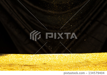Photo of golden glitter powder sand creating abstract bokeh festive atmosphere. Bokeh of particle element of gold glitter sand light up luxury background, sparkle glow wallpaper Photo of golden glitter powder sand creating abstract bokeh festive atmosphere. Bokeh of particle element of gold glitter sand light up luxury background, sparkle glow wallpaper 134579404