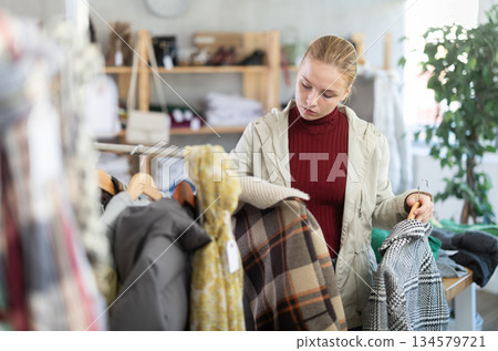girl, female, teenage, teen, young, 15-16, underage, European, Russian, customer, purchaser, shopper, selective, attentive, hesitant, thoughtful, choosing, buying, holding, looking, selecting, outwear girl, female, teenage, teen, young, 15-16, underage, European, Russian, customer, purchaser, shopper, selective, attentive, hesitant, thoughtful, choosing, buying, holding, looking, selecting, outwear 134579721