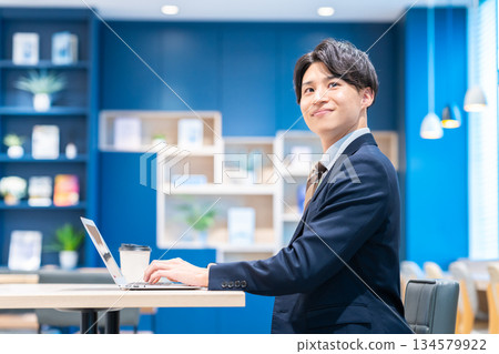 A young businessman working in the office A young businessman working in the office 134579922